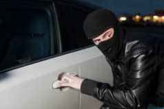 Man breaking into a car