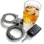 alcohol, car key and handcuffs representing dwi