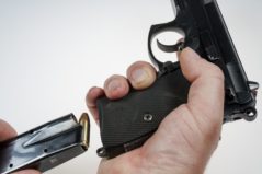 person reloading handgun